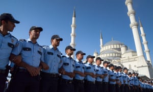 Police officers link arms