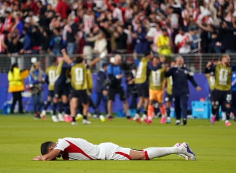 Turkey's Merih Demiral falls to the ground.