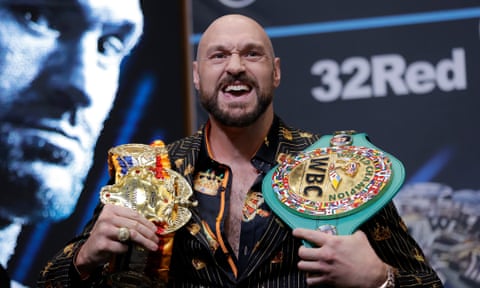 Tyson Fury with his belts