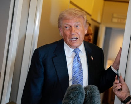 Donald Trump speaks to reporters on Air Force One