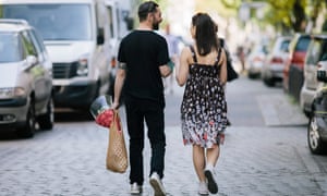 Couple walking down street