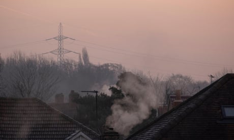 Central heating systems vent steam over houses in London, January