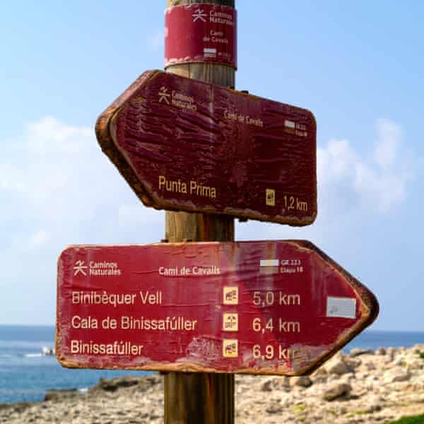Signpost on the Cami de Cavalls walking route, which follows the coast around Menorca, Balearic Islands,Spain,Europe.