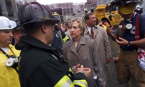 Hillary Clinton listens to firefighters during a tour of the World Trade Center disaster site in September 2001.
