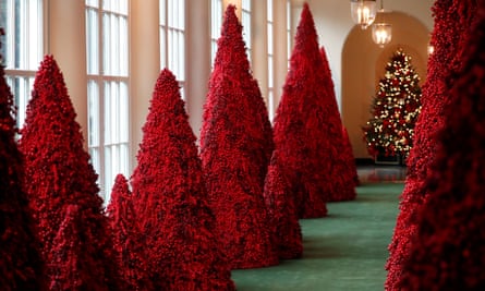 Trees made from red berries line the East Colonnade at the White House.