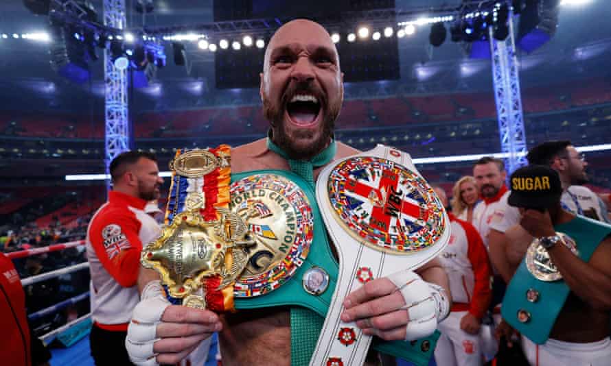 Tyson Fury with his belts after the fight.