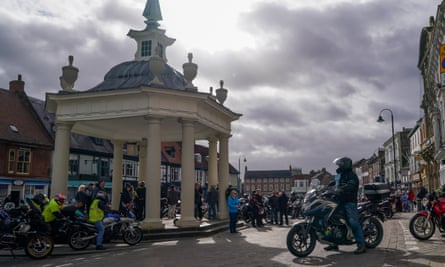 Motoryclists and onlookers in Beverley marketplace
