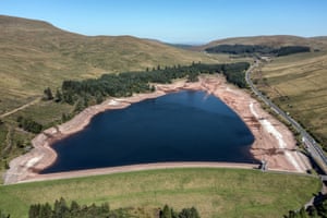 The water level at Beacons reservoir in Merthyr Tydfil, Wales, lies low during the latest heatwave