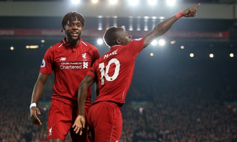 Sadio Mané celebrates with Divock Origi of Liverpool after scoring Liverpool’s opening goal against Watford.