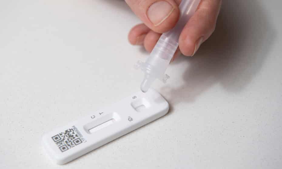 Close-up of someone doing a lateral flow test