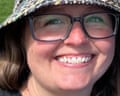 a woman in glasses and a hat