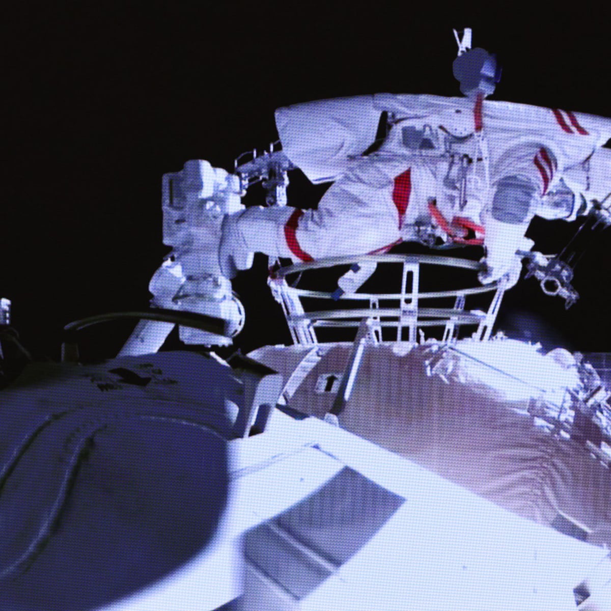 Astronauts at China's new space station conduct first spacewalk | China | The Guardian