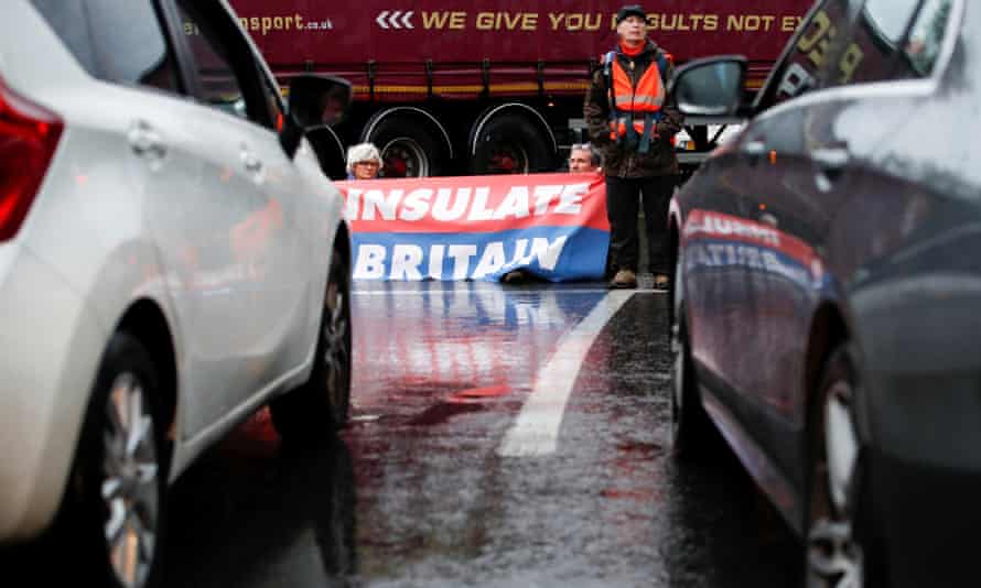 Insulate Britain activists block a motorway junction near Heathrow airport in London.