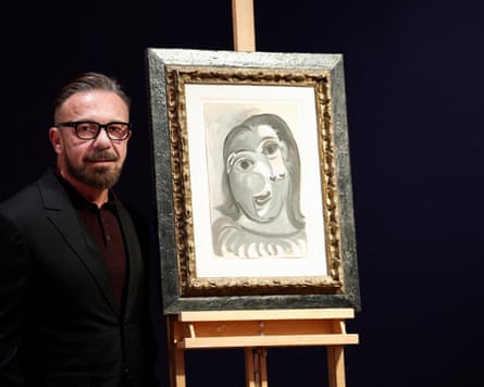 Olivier Picasso, grandson of the artist, poses next to Tête de femme