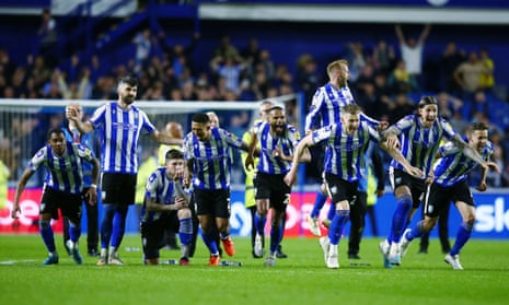The Sheffield Wednesday players react after Jack Hunt’s winning penalty against Peterborough fired the  Owls to Wembley. 