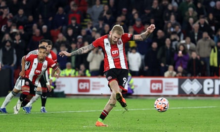 Oli McBurnie scores from the penalty spot for Sheffield United against Manchester United.