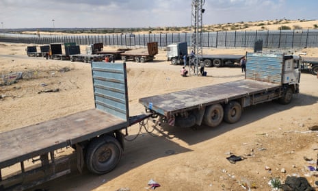 Palestinian truck drivers and United Nations vehicles wait near the Rafah border gate on the Gazan side to cross the Egyptian side.