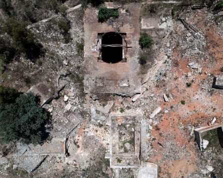 Aerial view of the Durban Deep goldmine, with a dark shaft opening amid rubble