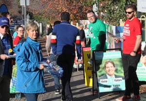 The "how to vote" cards are handed out in a voting booth in Balvon for Cooog's headquarters.