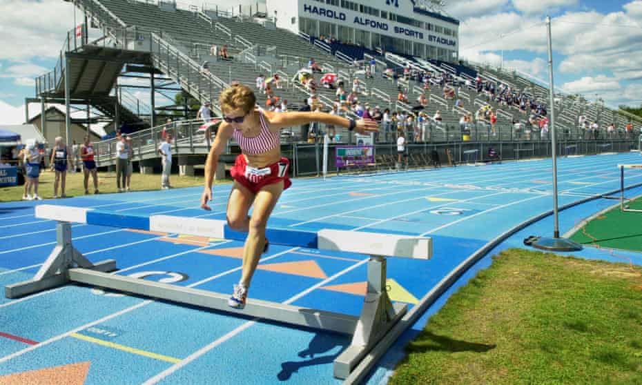 Pam Alley-Morrill clears a hurdle while competing in the women’s 2,000-metre steeplechase.