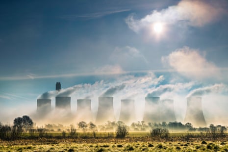 the eight cooling towers at Ratcliffe-on-Soar, Nottinghamshire, seen from a misty field