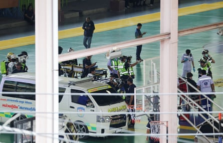 Rescuers stand near an ambulance at Debsirin Nonthaburi school