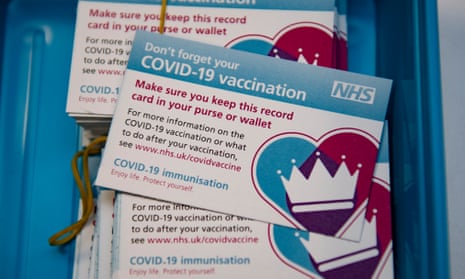 NHS Covid-19 vaccination cards.