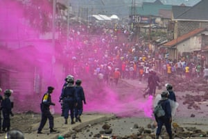 Fuchsia-coloured flares are launched by DRC police forces during a demonstration in Goma.