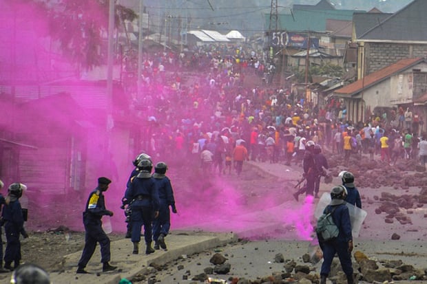 Fuchsia-coloured flares are launched by DRC police forces during a demonstration in Goma.