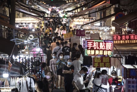 People visit a night market in Baocheng Road, Wuhan, on 3 June 2020.
