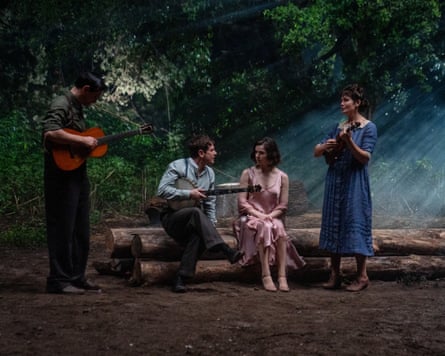 Jack O'Connell and two other Sinners cast members playing instruments to Hailee Steinfeld in a wood