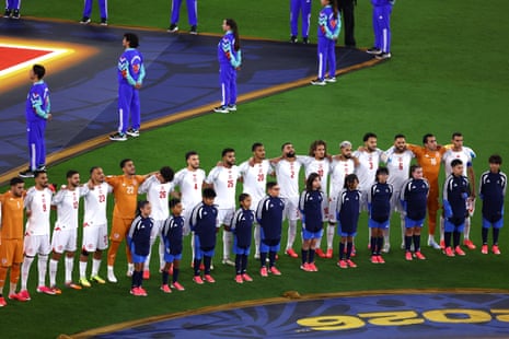 Tunisia players line up during the national anthems before the match