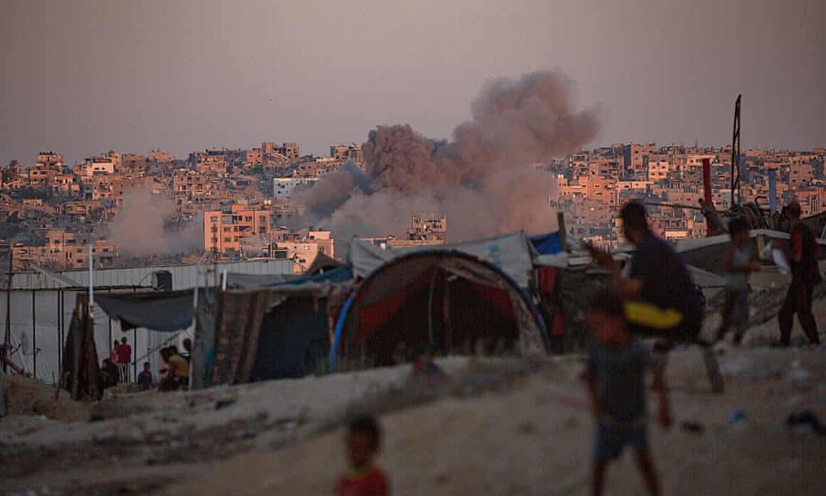 Smoke rises above buildings