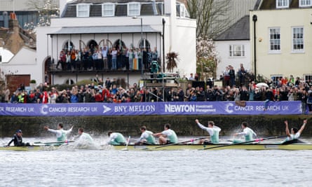 Cambridge celebrate after crossing the line to win the 2016 university boat race, sponsored by US bank BNY Mellon.