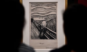 Art enthusiasts look at Edvard Munch’s The Scream at the British Museum, London.