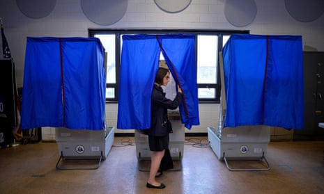 A voter leaves the booth after casting her ballot in the Pennsylvania