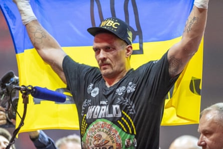Oleksandr Usyk celebrates beating Tyson Fury