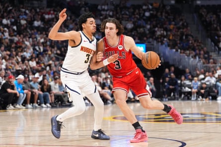Bulls guard Josh Giddey drives to the basket against Denver Nuggets center Moses Brown
