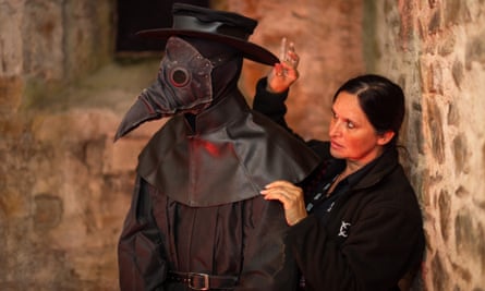 Kirsten Honey, the paranormal manager at Bodmin jail, adjusts a creepy artefact.