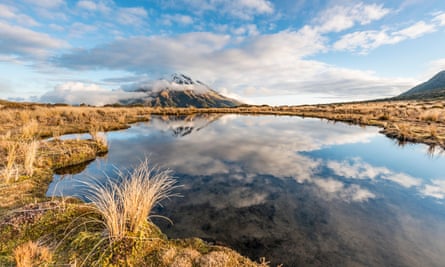 Reflection in Pouakai tarn of Mount Taranaki, referred to as a stratovolcano.