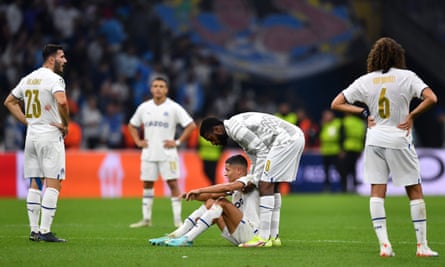 Marseille players react to their elimination from the Champions League.
