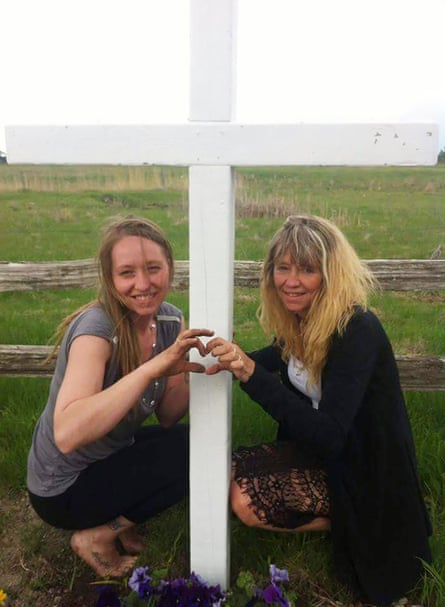 Sylvia McCulloch (right) with her daughter Sandy at the grave of her other daughter Emilie.