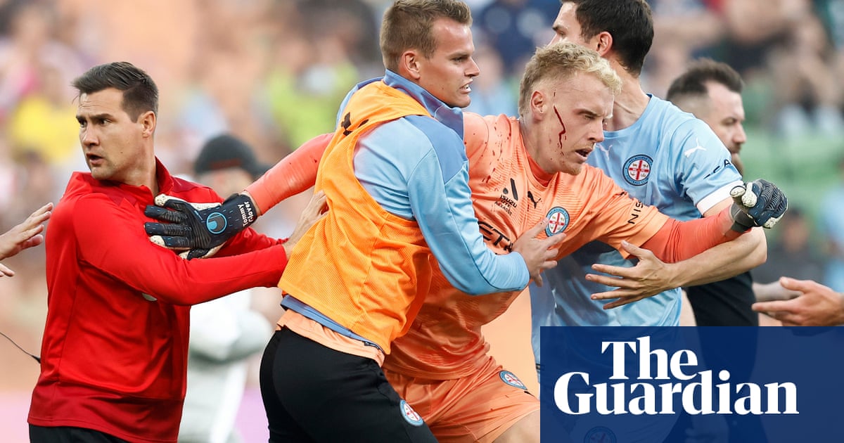 Police charge 32 people over Melbourne A-League pitch invasion and search for 11 more