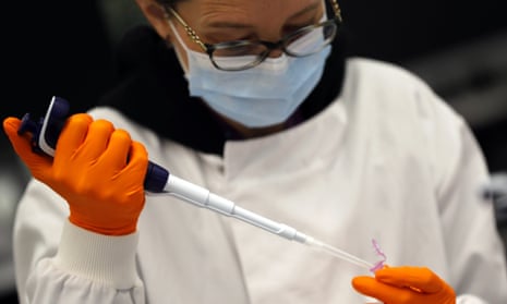 A lab assistant prepares coronavirus RNA for sequencing in Cambridge, England, March 2021.