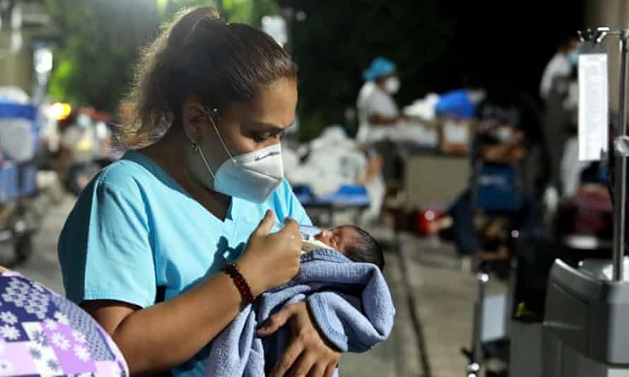 First Thing: Taliban name all-male Afghan cabinet | US news 2 A nurse takes care of a baby outside a hospital after patients and personnel were evacuated after an earthquake in Acapulco, Mexico.