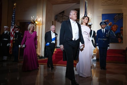 Donald and Melania Trump walking ahead of Charles and Camilla, all in formal wear