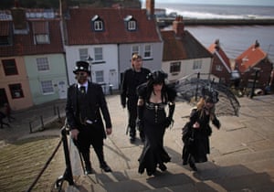 Goths and steampunks walk through Whitby during a goth weekend. The event started in 1994 and is held twice yearly.
