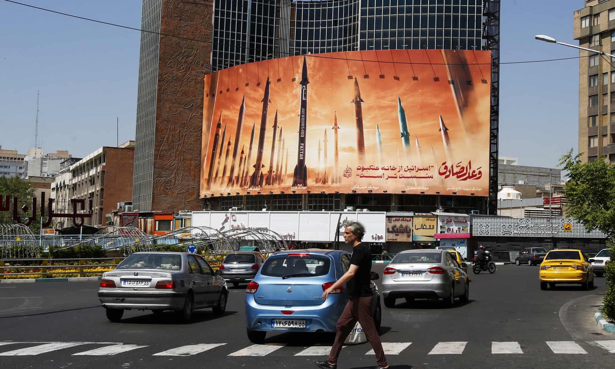 ‘Both the Israeli attack, and Iran’s efforts to play down its impact, were partly about saving face, but also about containing a situation that could otherwise spiral.’ A billboard poster depicting missiles, Tehran, Iran, on 19 April. Photograph: AFP/Getty Images