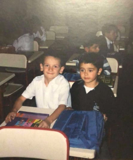 Giorgi Bliadze and Khvicha Kvaratskhelia sit together at a school desk as children
