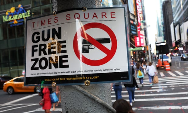 One of the signs marking the Times Square gun-free zone.